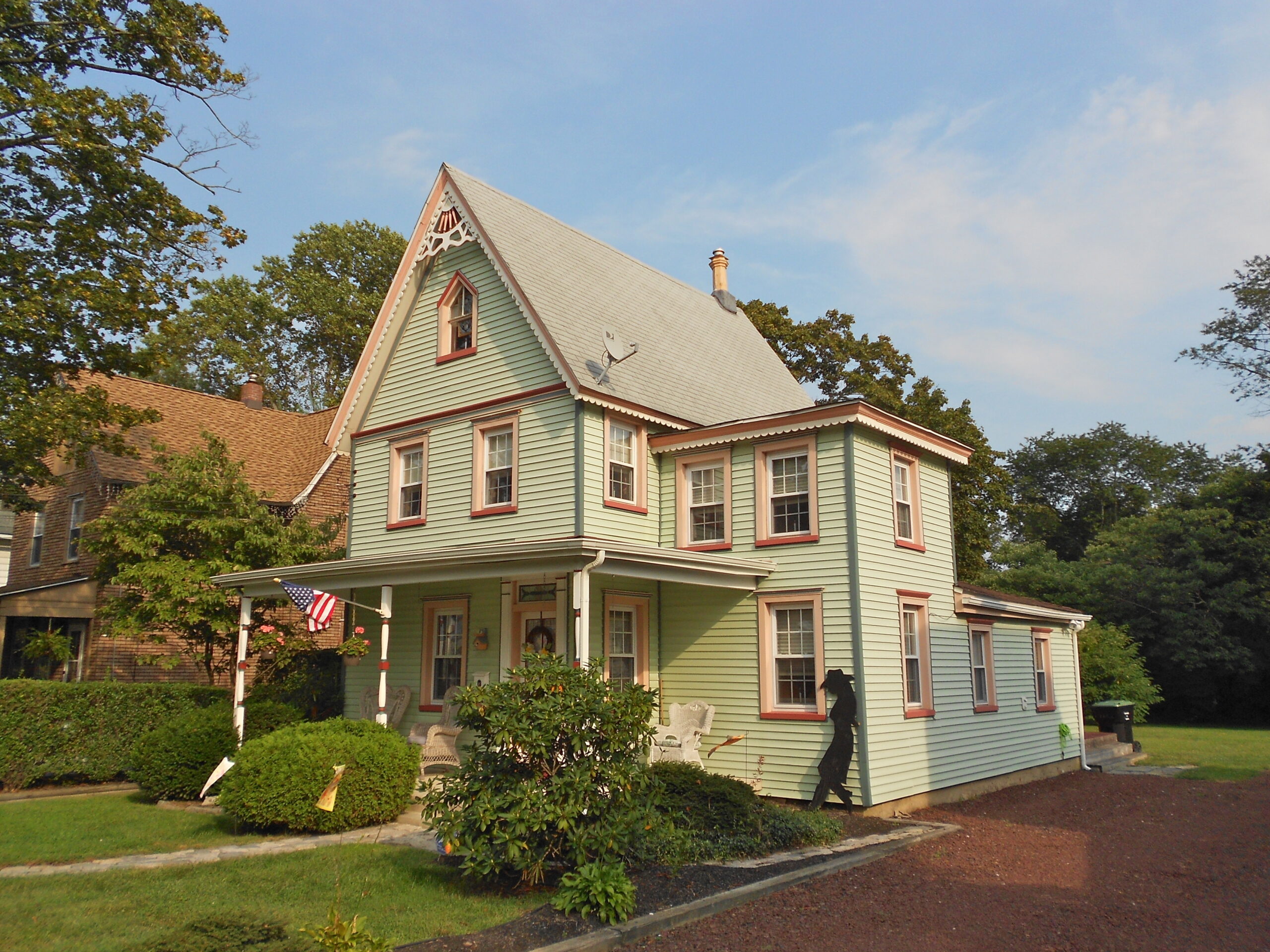 Mint-colored three-story house.