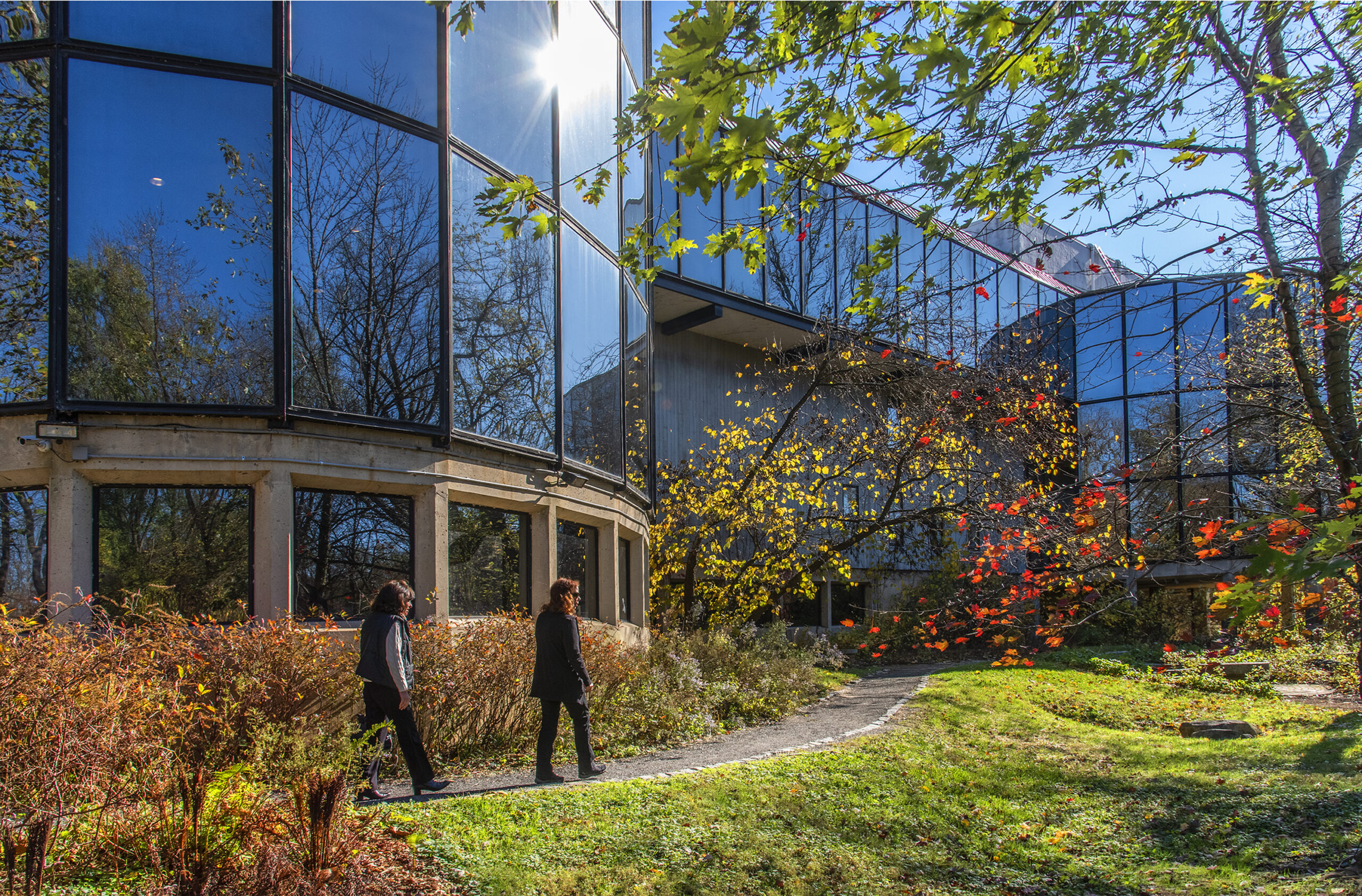 Two people walk outside the Brandywine Museum.
