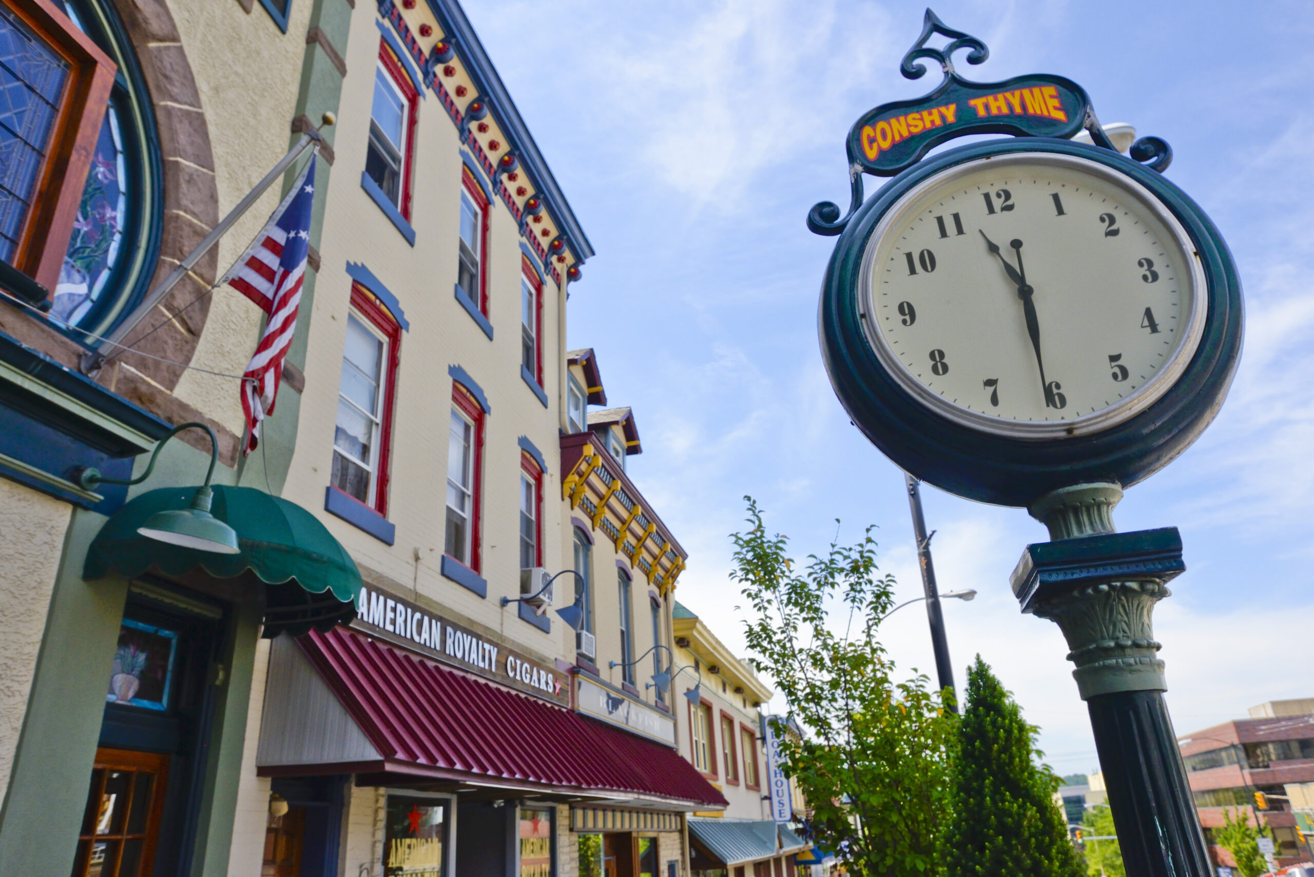 Colorful main street and street clock in Conshohocken.