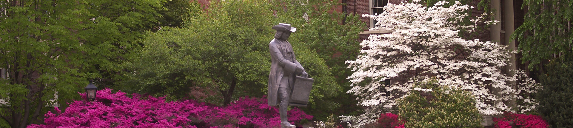 A statue of a historical figure stands in front of a hospital in Philadelphia.